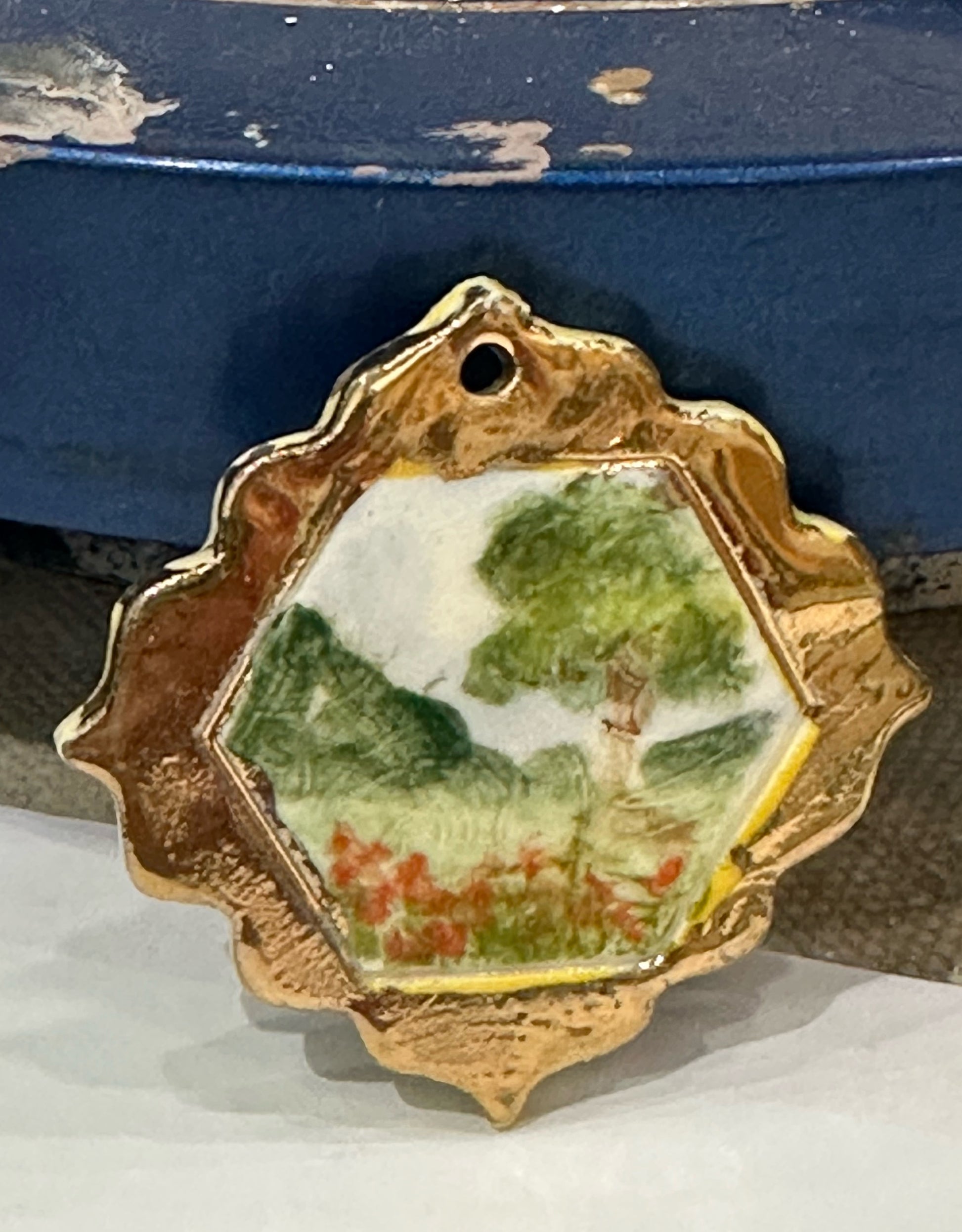 Miniature handpainted and handmade porcelain landscape with 22kt gold “frame”