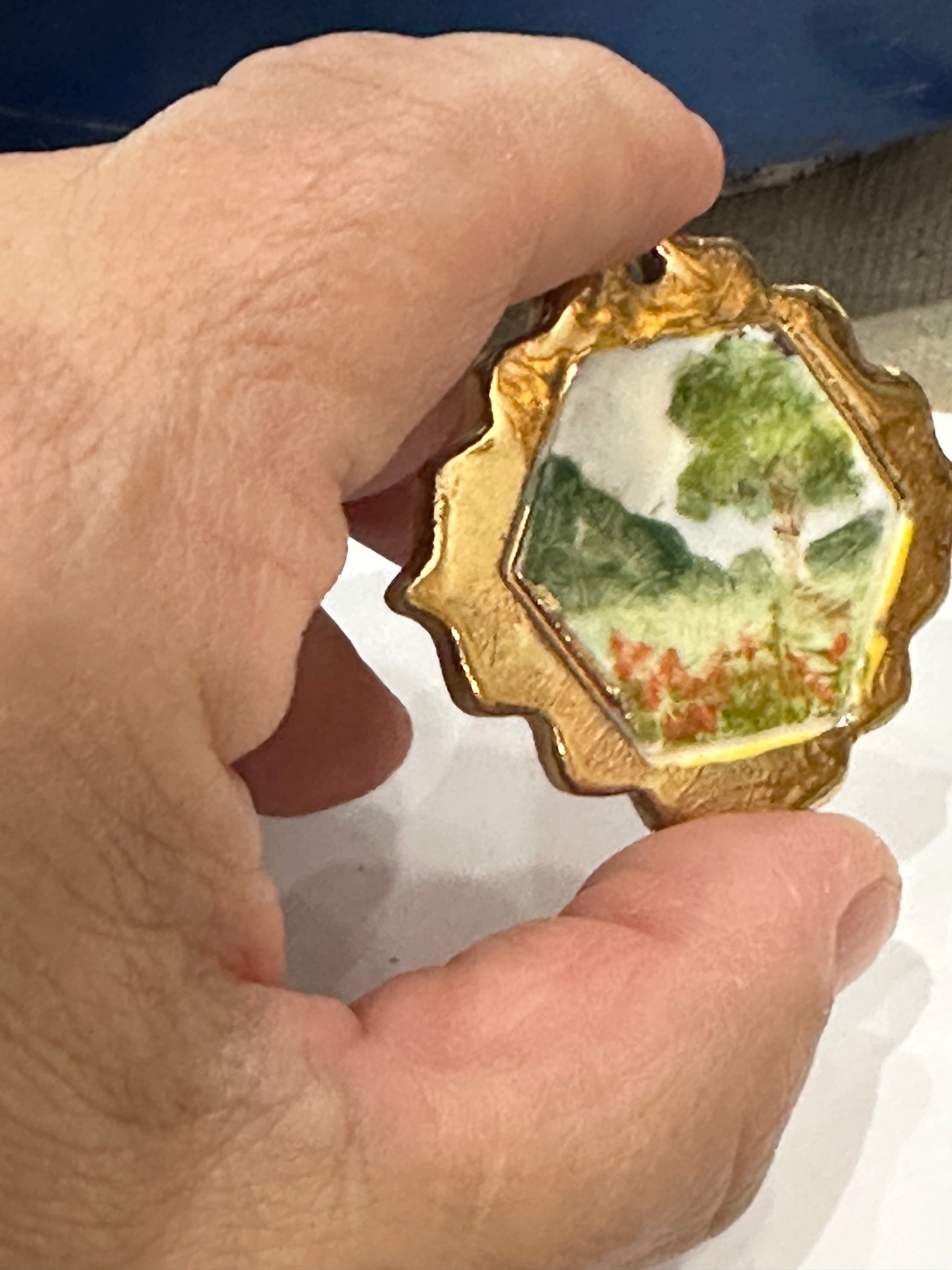 Miniature handpainted and handmade porcelain landscape with 22kt gold “frame”