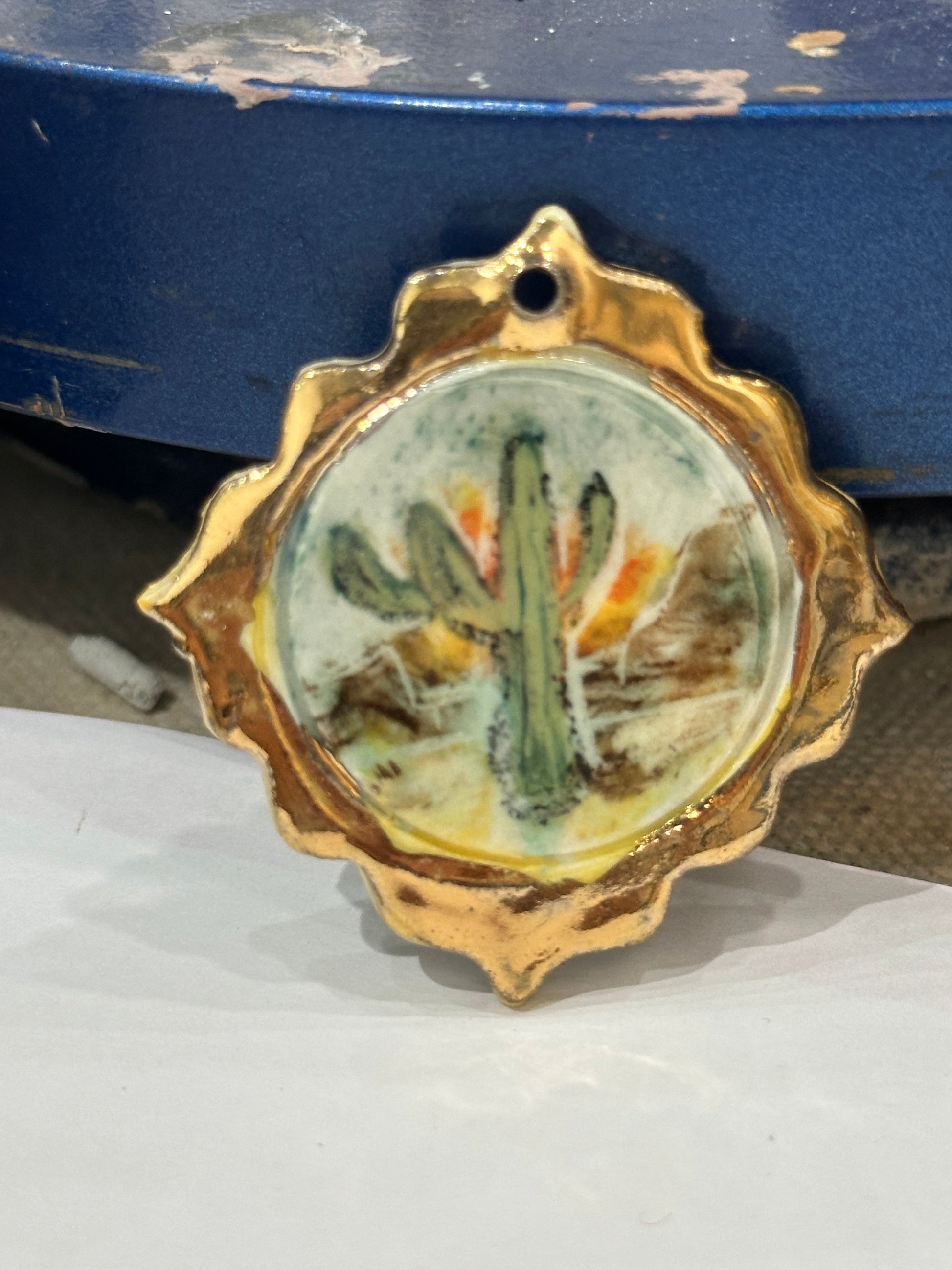 Miniature handpainted and handmade porcelain cactus with 22kt gold “frame”